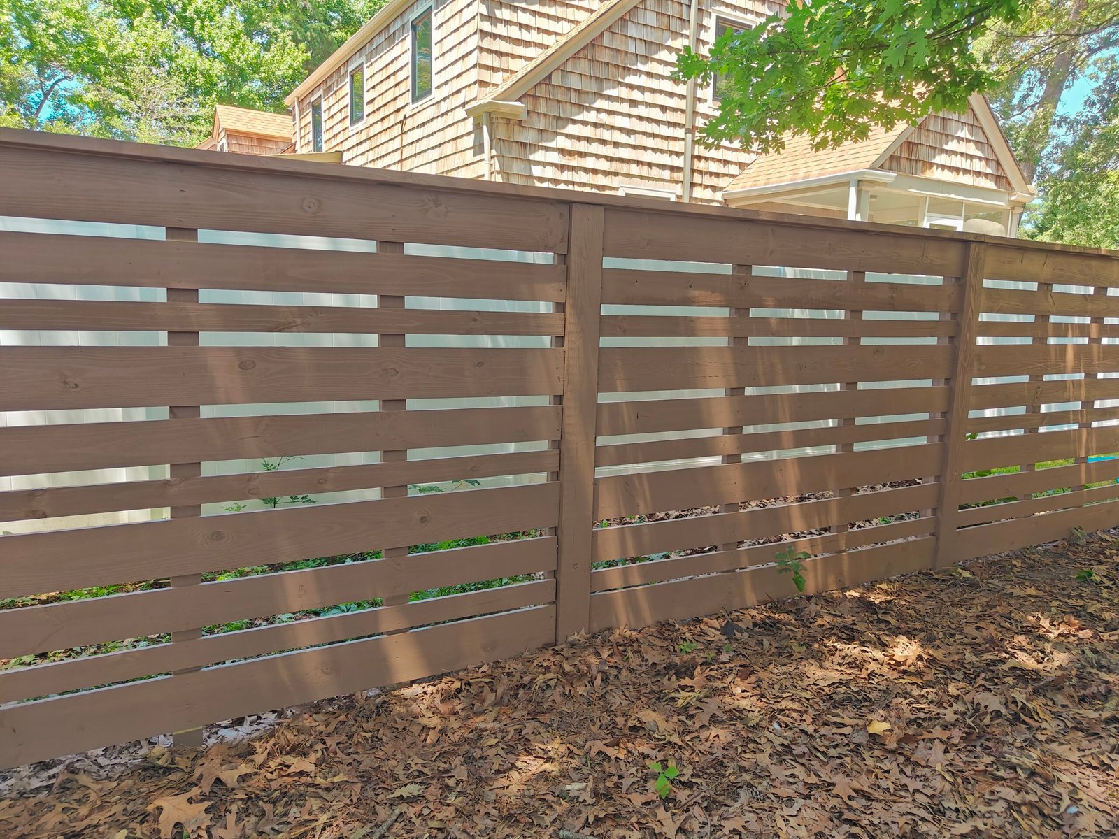 Custom fence installation project in Virginia Beach, VA by Evoke Design + Build