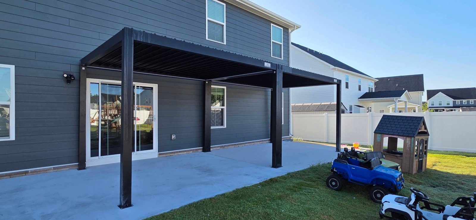 Double L5 Eagle Patio aluminum louvered pergola, 10x24, installed over a patio in Chesapeake, VA