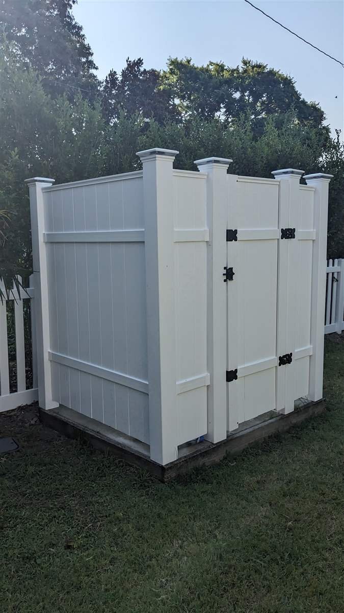 Custom outdoor shower enclosure built by Evoke Design + Build in Cape Charles, VA